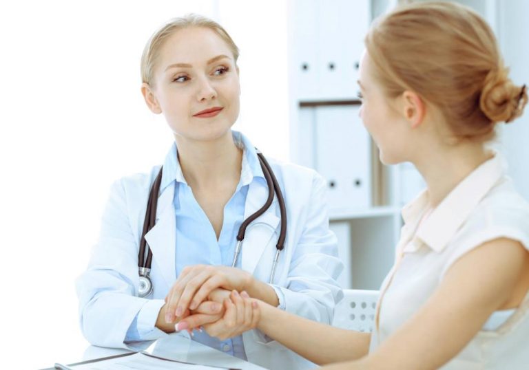 doctor and patient sitting at the desk