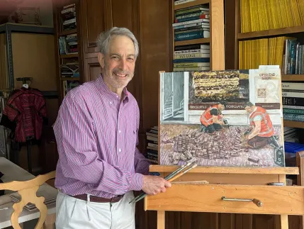 Doochin posing with a painting