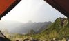a view from inside a tent of a mountain range