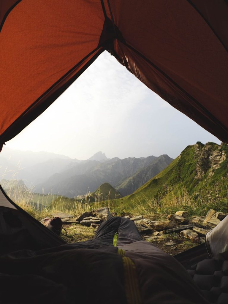 a view from inside a tent of a mountain range