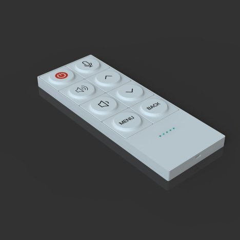 A white remote control lies on a reflective surface.
