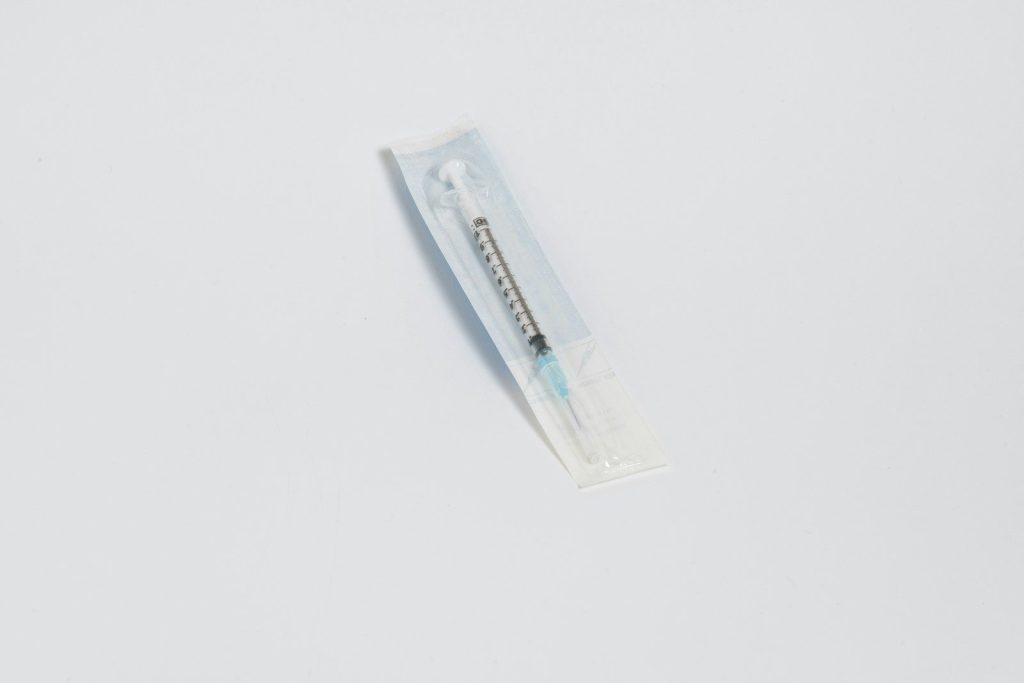 a toothbrush in a package on a white surface