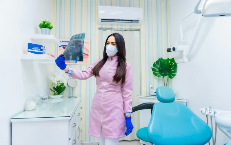 woman in pink long sleeve shirt holding blue and white plastic pitcher. food to eat after extracting tooth