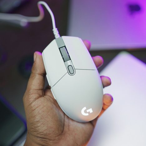A person holding a computer mouse in their hand