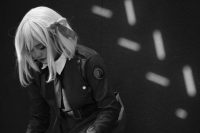 Woman in costume with blonde wig and bow