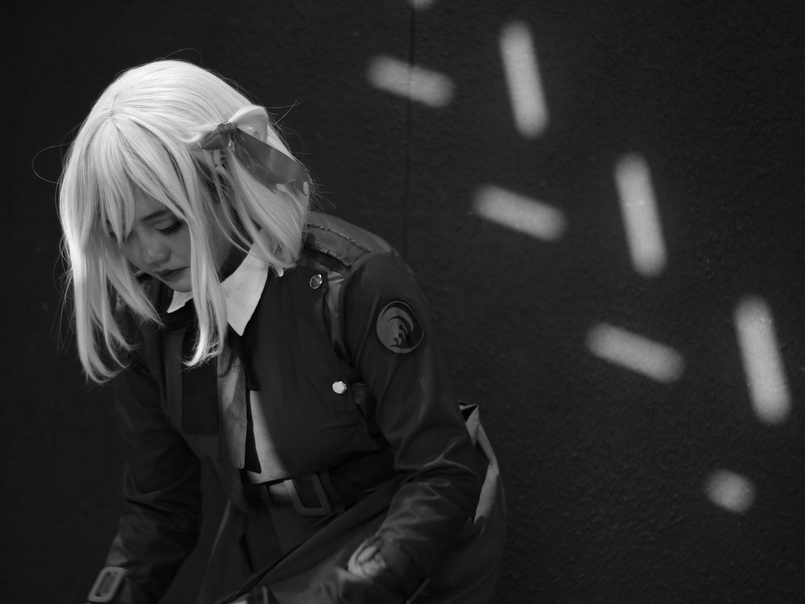 Woman in costume with blonde wig and bow