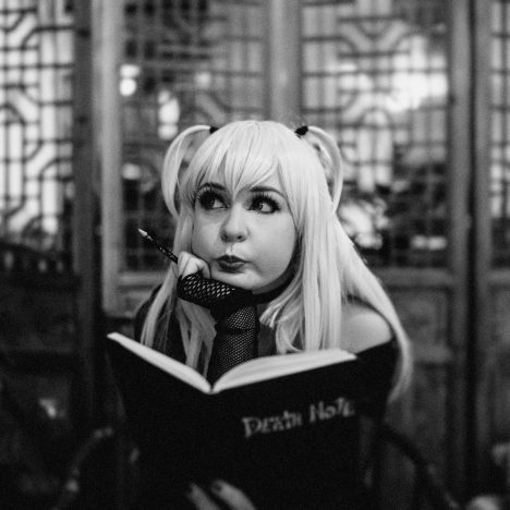 a woman with long blonde hair is reading a book