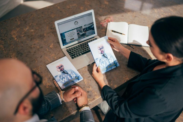 man in black jacket sitting beside woman in black jacket