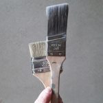 a hand holding a metal object