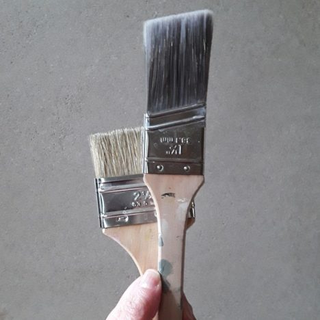 a hand holding a metal object